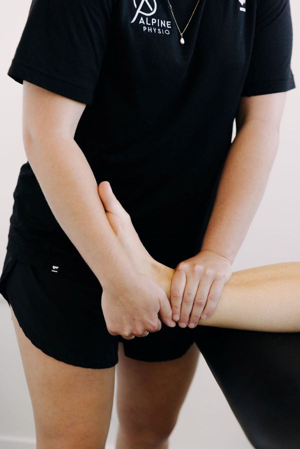 physio treating ankle injury in Wanaka Ankle injury management with Peace and Love